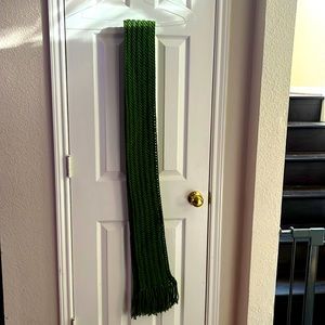 Olive green knitted scarf. picture of scarf is folded in half.  Handmade